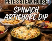 Pete's Steak House Spinach Artichoke Dip in a bowl, being severed with chips